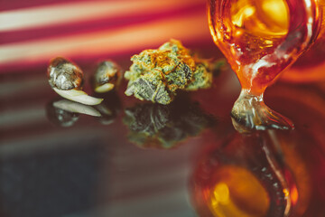 Cannabis seeds, flowers and oil with flag of USA.