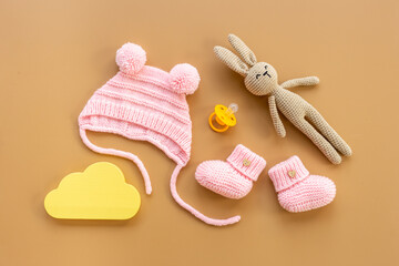 Baby girl pink hat with booties and accessories, top view