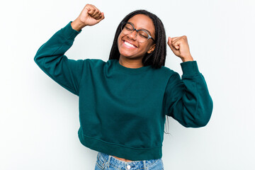 Fototapeta premium Young African American woman isolated on white background celebrating a special day, jumps and raise arms with energy.