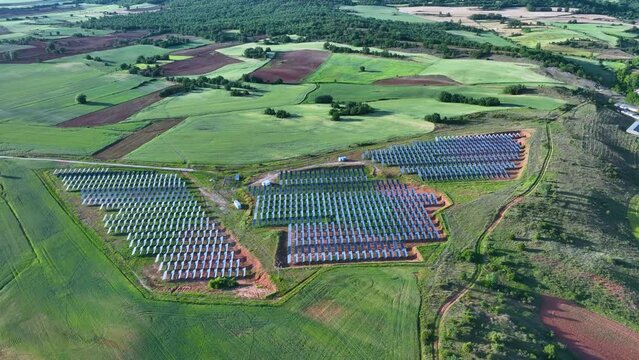 Solar panels. Photovoltaic plant and cultivated fields in the surroundings of the town of Hortigüela. Aerial view from a drone. Arlanza region. Burgos, Castilla y Leon, Spain, Europe