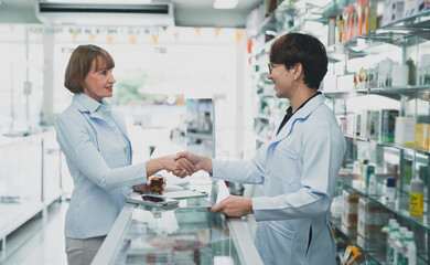 pharmacist man advice At the pharmacy.Pharmacist assistant sending prescription to doctor.expertise Pharmacy business.doctor check drug at drugstore.