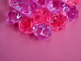 Delicate purple and pink crystals on a pink background