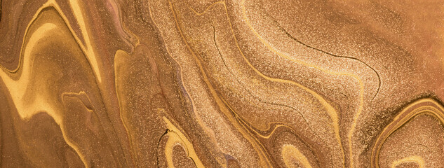 Abstract fluid art background golden and bronze colors. Liquid marble. Acrylic painting with brown...