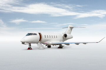 Modern white executive airplane with an opened gangway door isolated on bright background with sky