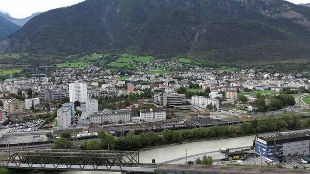 Aerial view of the village of Brig Glis and in the middle of the picture you can see the hospital of Brig and in the foreground is the freight station