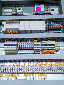 Mitsubishi PLC Modules In A Row In Electrical Cabinet Of Automation Control System On Industrial Plant.