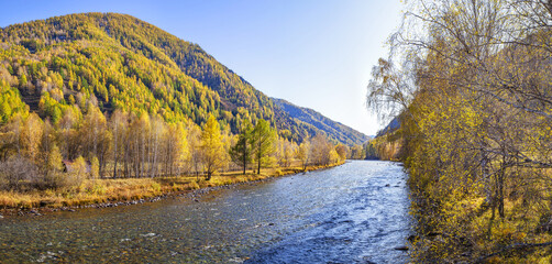 Autumn landscape with a mountain river. Indian summer.
