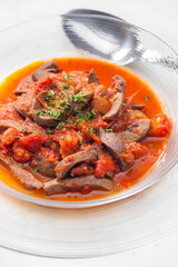 still life of kidney stew with tomatoes