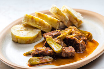 beef meat with picles sauce and dumplings