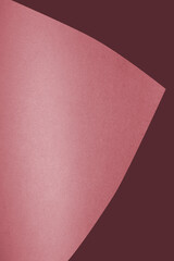 Dark and light red brown papers forming heart or le aaf like shape textured background	