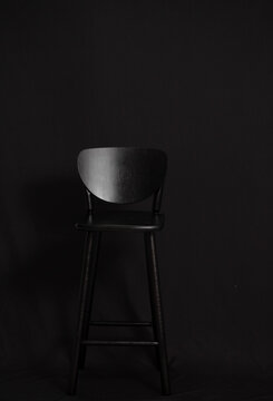 black chair on a black background