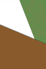 Plain vs textured dark deep shades of yellow green brown and white color papers intersecting to form a triangle shape for cover design