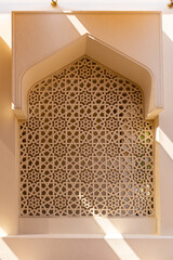 Arabic style mosque window with carved stone openwork, example of Islamic art, Dubai, United Arab...