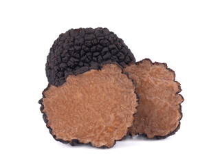 Black truffles isolated on a white background. Fresh sliced truffle. Delicacy exclusive truffle mushroom. Piquant and fragrant French delicacy. Clipping path.