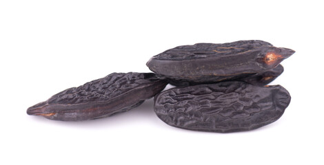Tonka beans isolated on white background. Bean of Dipteryx odorata, cumaru or kumaru. Fresh aroma tonka beans.