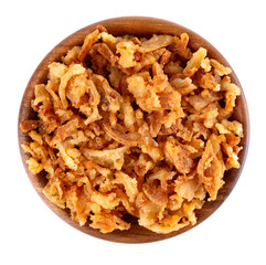 Roasted onions in wooden bowl, isolated on white background. Crispy fried onions. Top view.