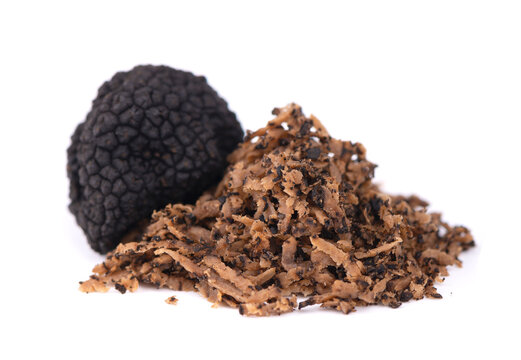 Black truffles isolated on a white background. Fresh sliced truffle. Delicacy exclusive truffle mushroom. Piquant and fragrant French delicacy. Clipping path.
