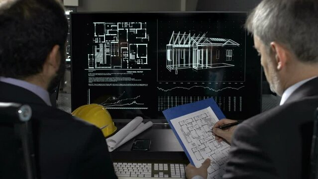 Engineers working on computer