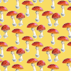 Seamless pattern of hand-drawn red fly agarics on a Yellow background. For fabric, sketchbook, wallpaper, wrapping paper.
