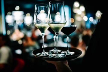 alcohol cocktail and wine set on a waiter tray in bar