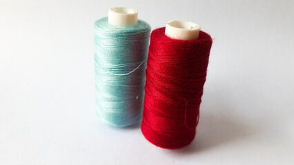 spools of colorful yarn on a white background