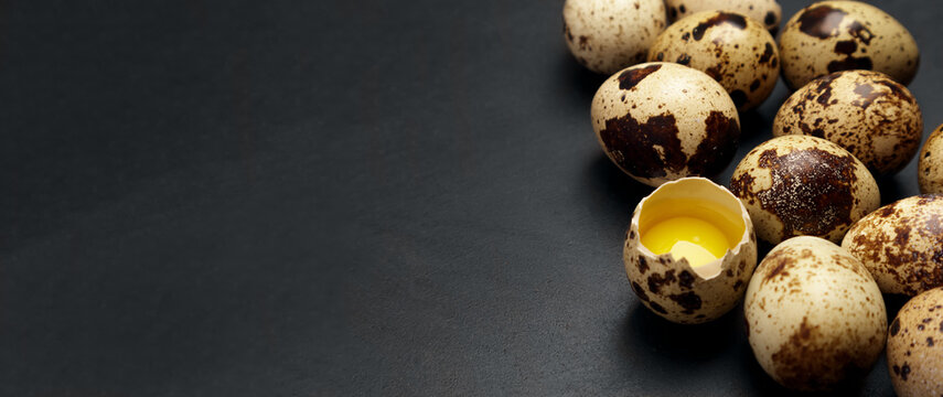 Quail eggs on black background. Healthy food concept. Selective focus
