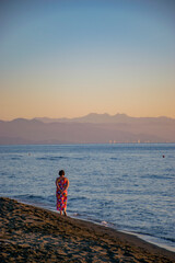 person walking over the sea