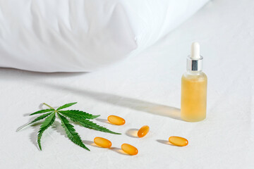 Melotonin production, pills, capsules and cbd oil on the bed. Concept sleep disorder. beat insomnia and restore sleeping routine.