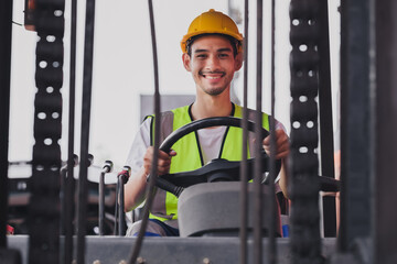 Young Asian work man driving the truck over construction site. Industrial factory worker operating on forklift in the import export shipyard. Foreman at warehouse logistic in Cargo freight ship.