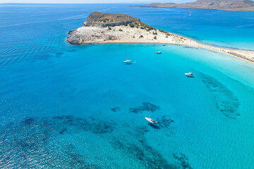 Fototapeta na wymiar Aerial view of Simos beach in Elafonisos. Located in south Peloponnese elafonisos is a small island very famous for the paradise sandy beaches and the turquoise waters.