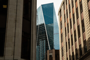 glass building between classical architecture in London, England