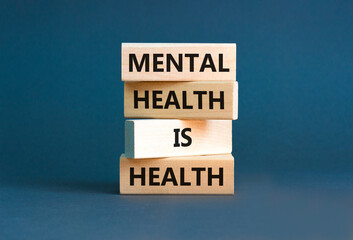 Mental health psychological symbol. Concept words Mental health is health on wooden blocks on a...