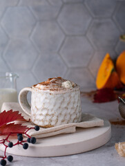 Beautiful cup of coffee on wooden table with chocolate cookies. pastel tone. Vertical