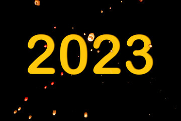 Number 2023 with the background of lanterns in a night sky. New year concept