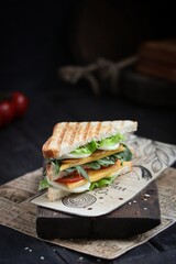 Sandwich on a wooden background.