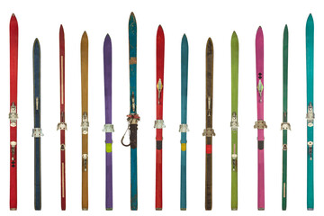Row of vintage weathered colorful skis - obrazy, fototapety, plakaty