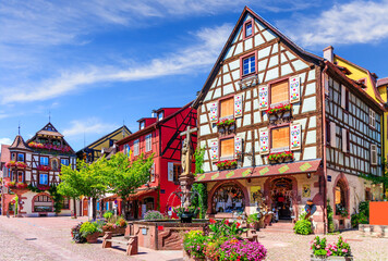 Kaysersberg Vignoble, France. Picturesque street with traditional half timbered houses on the...