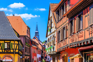 Fototapeta na wymiar Kaysersberg Vignoble, France. Picturesque street with traditional half timbered houses on the Alsace Wine Route.
