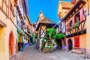 Fototapeta na wymiar Eguisheim, France. Colorful half-timbered houses in Alsace.