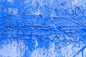 Abstract background from an old fenced wall in blue.