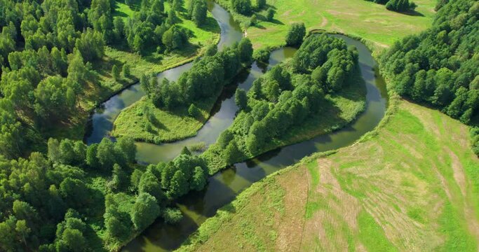 beautiful landscape with a small meandering river (aerial shot)	