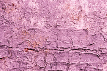 Obraz premium Abstract background of old damaged purple paint on the wall.