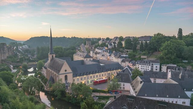 Grand Duchy of Luxembourg time lapse 4K, city skyline night to day sunrise timelapse at Grund along Alzette river in the historical old town of Luxembourg