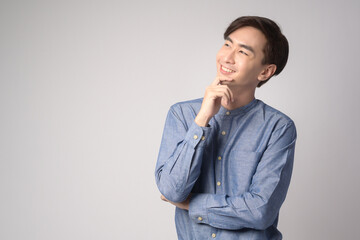 Portrait of young asian man over white background studio.