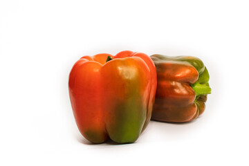 Colorful vegetables, yellow, green and red bell peppers on white background