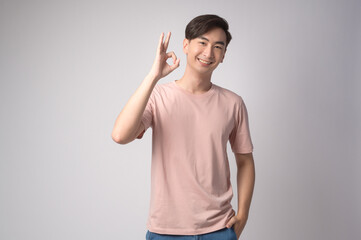 Portrait of young asian man over white background studio.