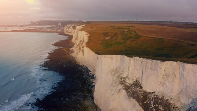 Aerial drone shot along white cliffs of dover. Beautiful aerial over the white cliffs of Dover.  English Channel in summer, England. Seven Sisters National park, East Sussex, England south coast.