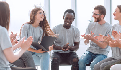 group of young people applauding the coach after class.