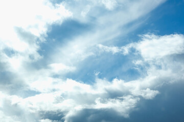Naklejka na ściany i meble Blue sky with white clouds. Beautiful cloudy sky. Skyward. Endless skyline. The sky at dawn.