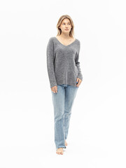Grey cashmere sweater. Woman in warm blouse for autumn or winter on white background. Comfortable style. In full growth